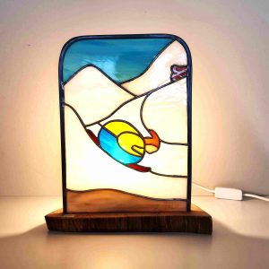 Lampe en vitrail Tiffany : Le skieur fait l'oeuf